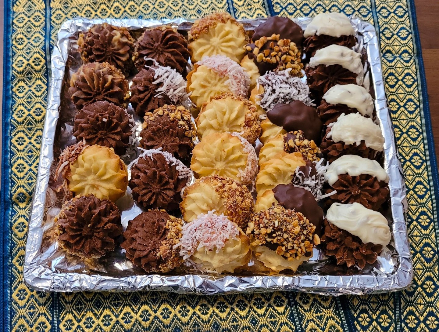 Tray of assorted petit four — chocolate-dipped, coconut-dusted and nut-coated handmade sweets